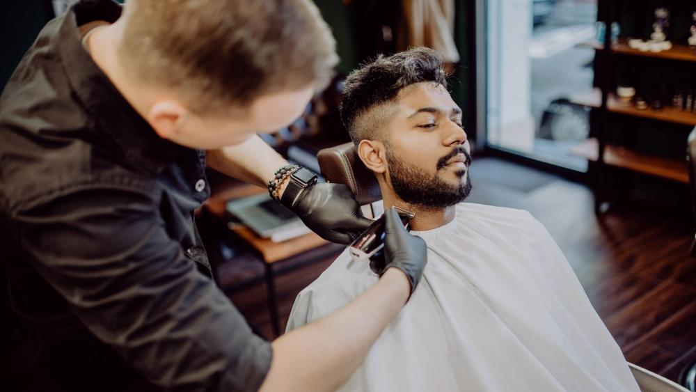 barber shaping beard