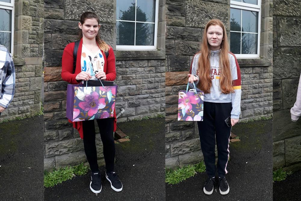 From left to right: Winner - Seren-Haf Davies, runner up - Llinos Dando and highly commended - Kaitlin Law and Maegen Kenvin with their art prizes.