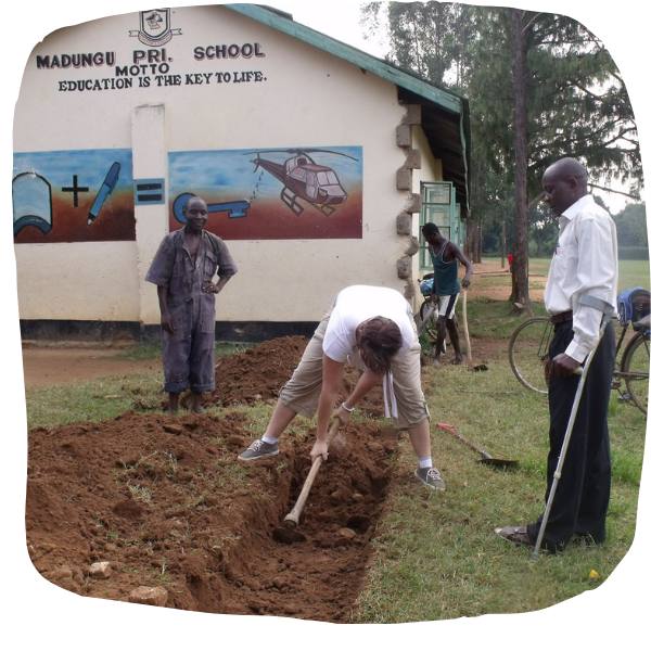 student helps at Madungu primary school