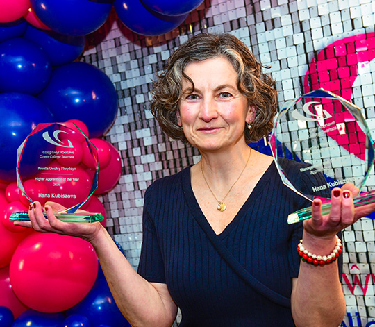 Apprenticeship award winner with two trophies