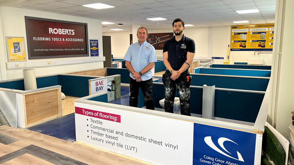 Two staff members at the new flooring facility