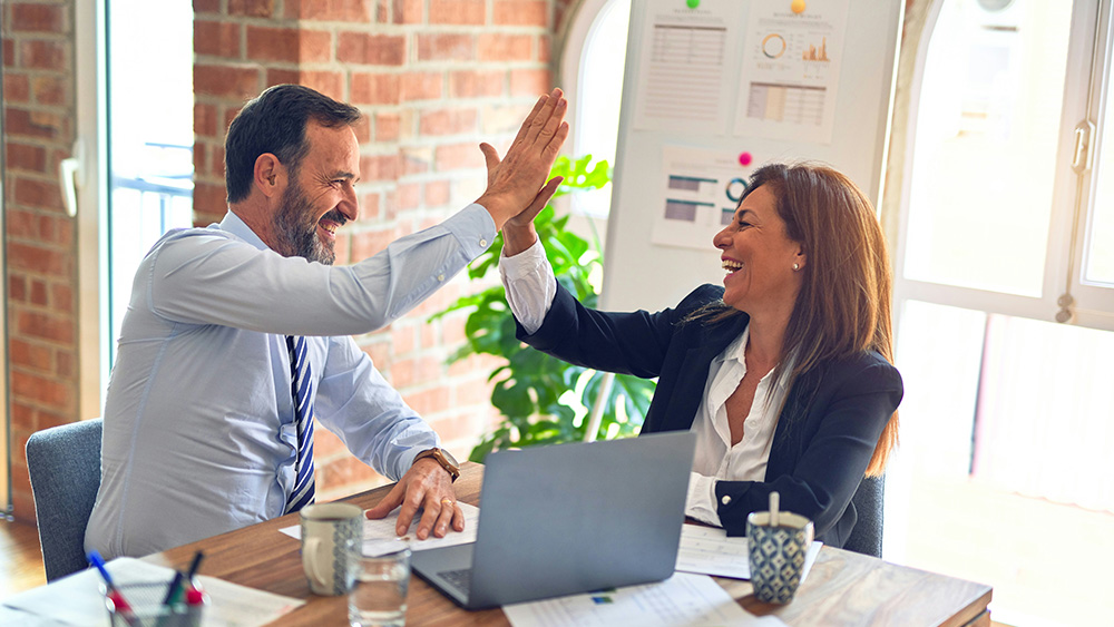 Business people high-fiving
