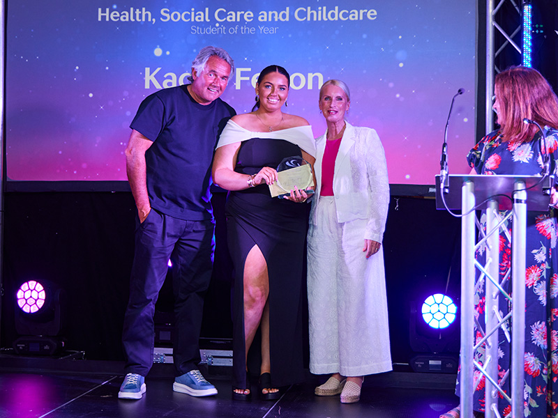 Kacey Felton on stage receiving award
