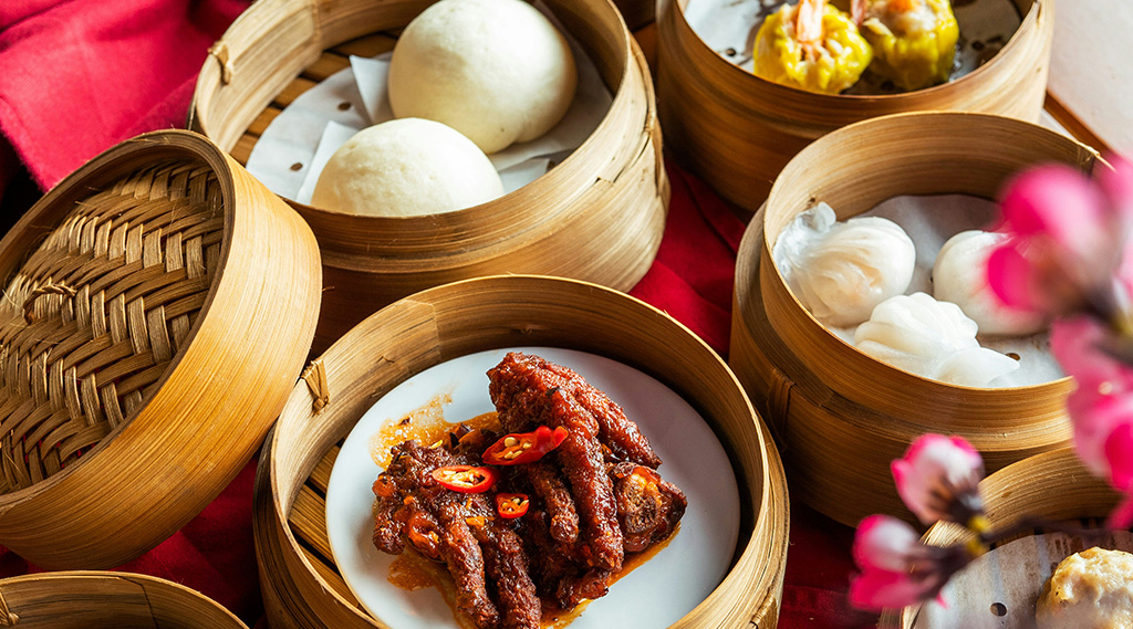 A selection of chinese food in bamboo steamers