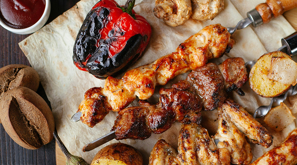 Meat skewers with charred peppers