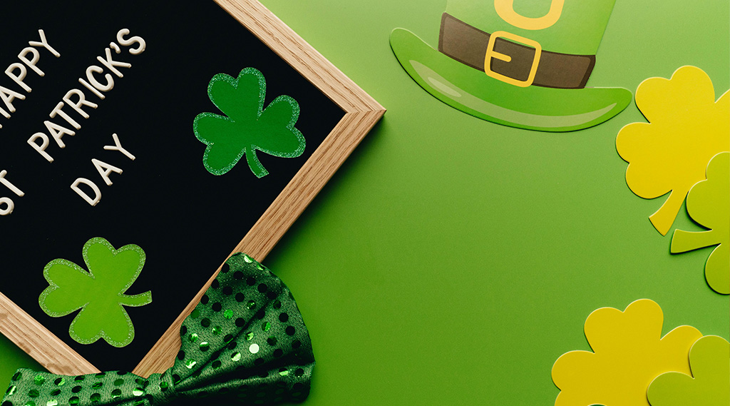 St Patricks Day hat and four leaf clover paper-cutouts