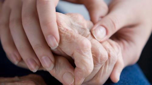 Two people holding hands
