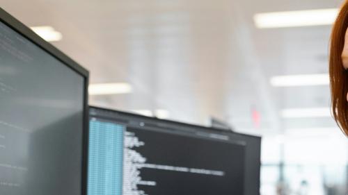 A person reviews information on their computer. 