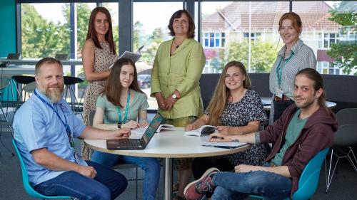 Future teachers sitting around a table