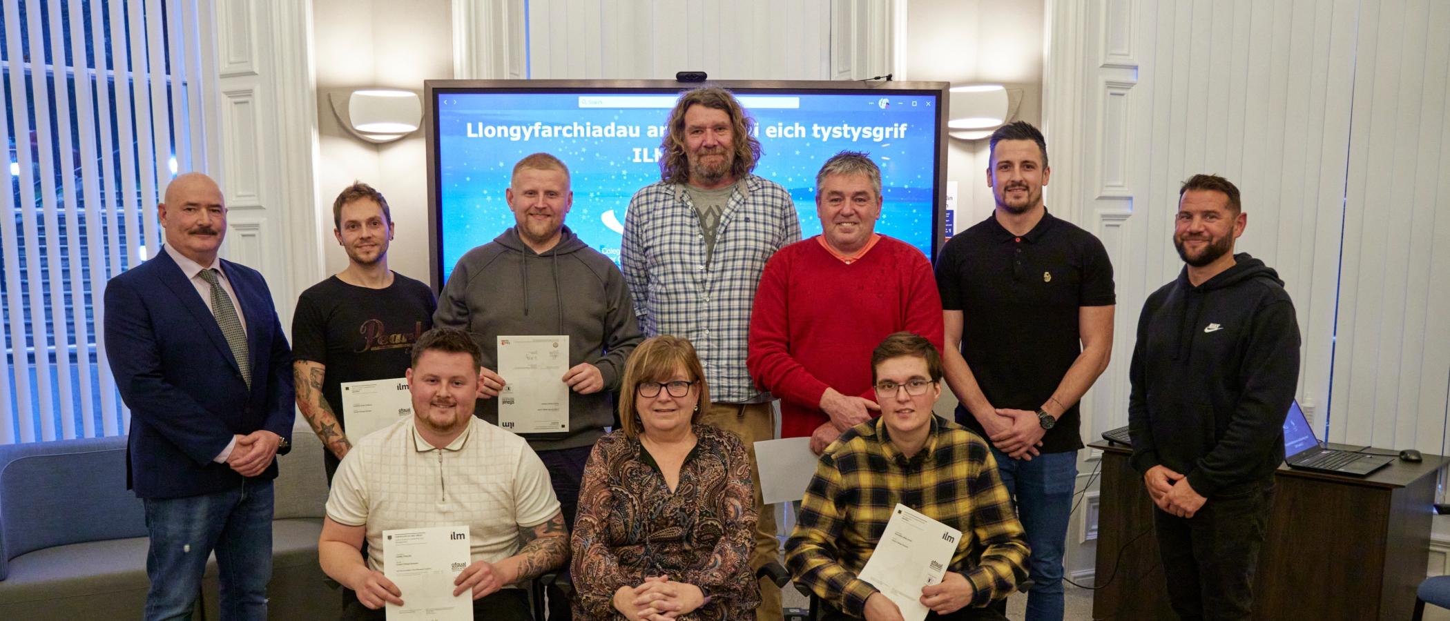 A group picture featuring the successful learners and their tutor, Susan Washer.