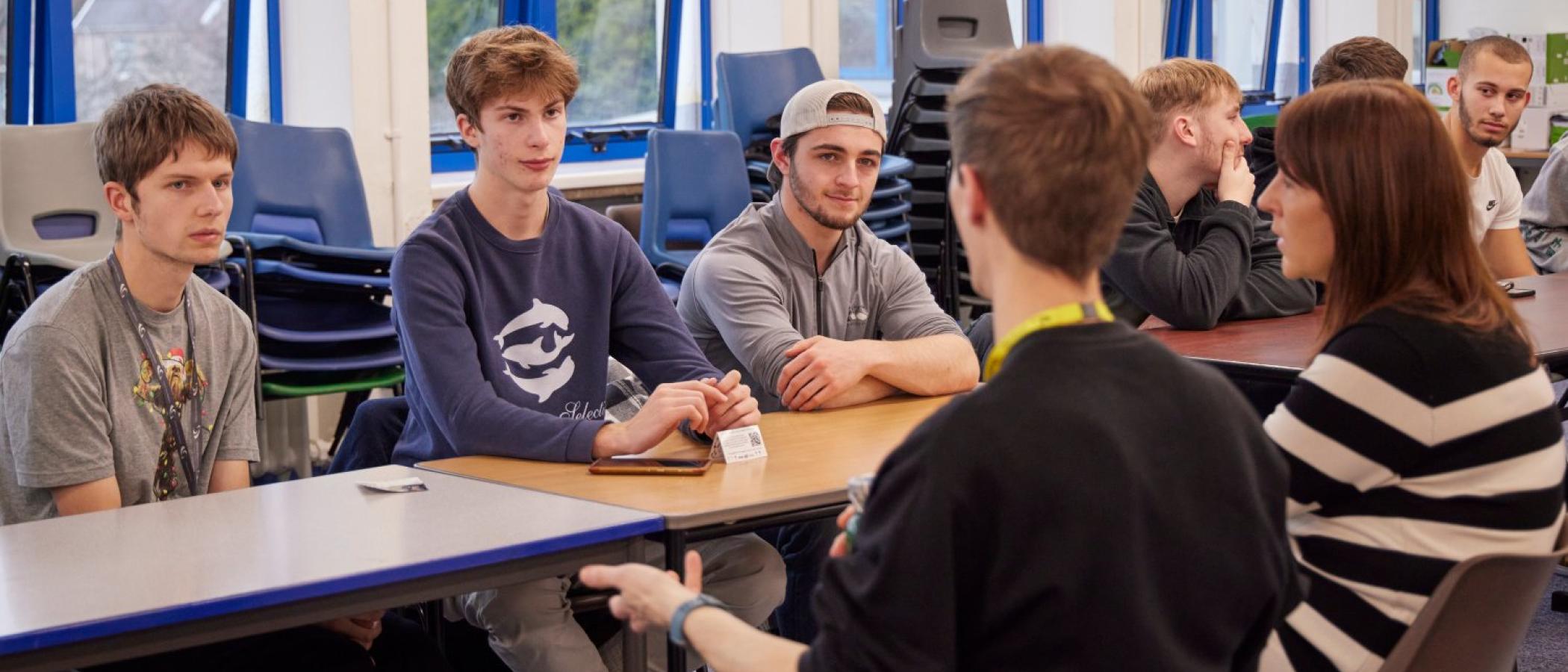 Students listening to a speaker