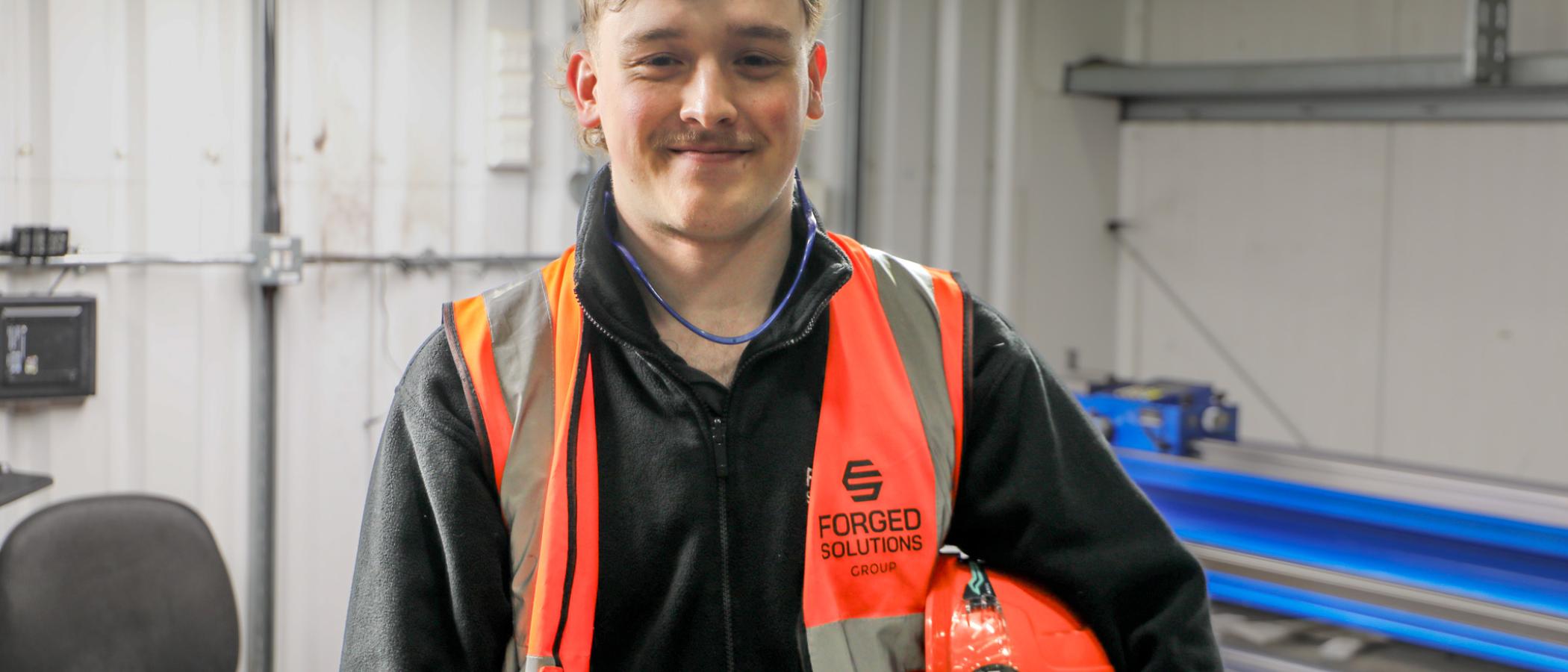 Degree apprentice Lewys Brill pictured in his workplace.