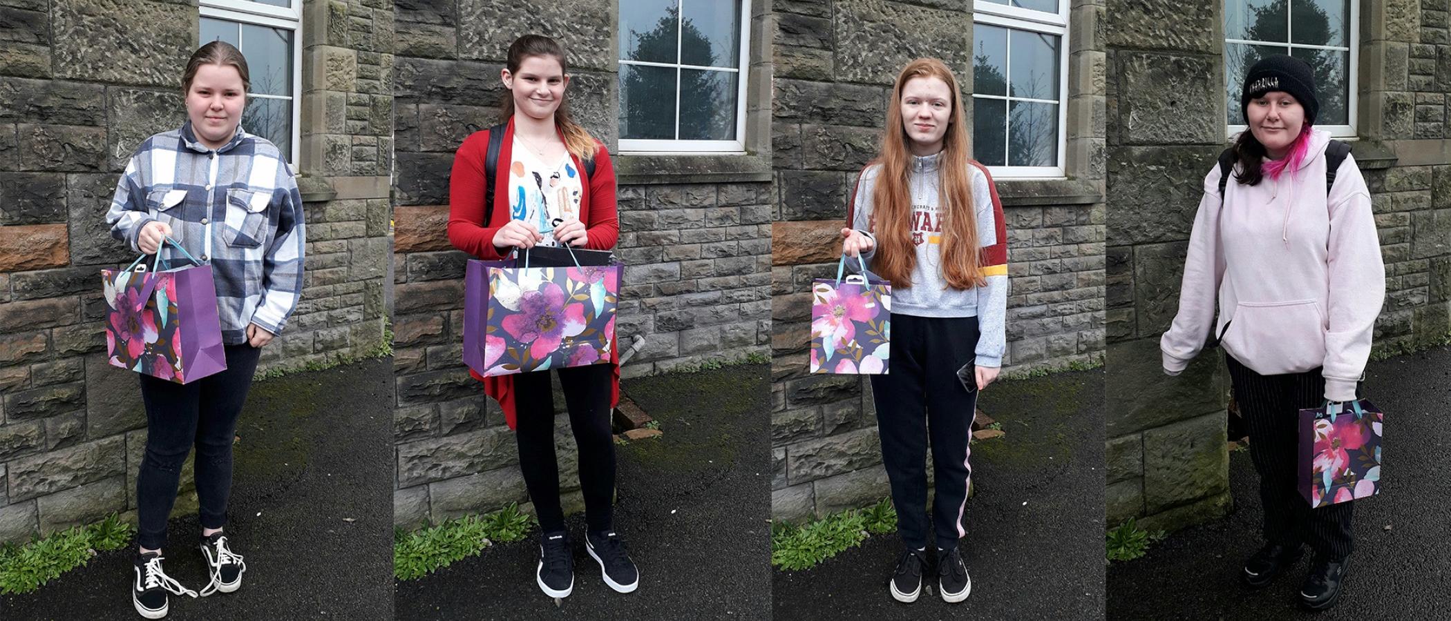 From left to right: Winner - Seren-Haf Davies, runner up - Llinos Dando and highly commended - Kaitlin Law and Maegen Kenvin with their art prizes.