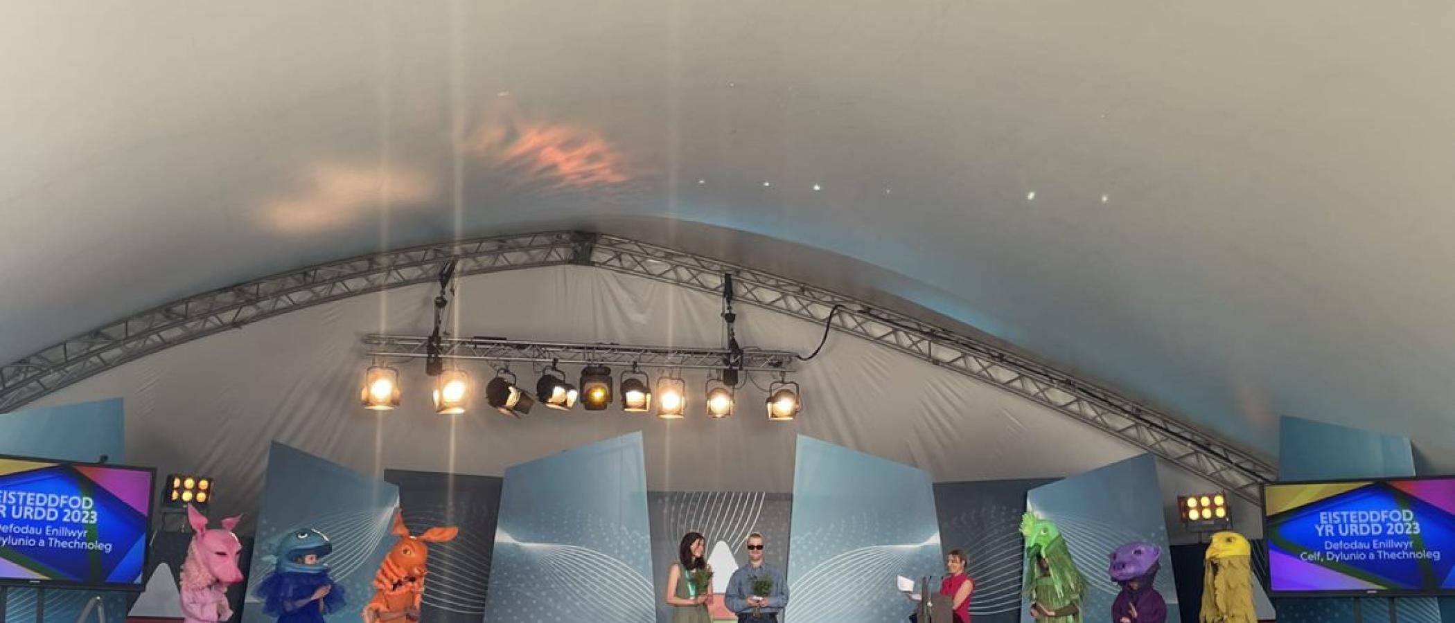 Costumes on display on stage at URDD Eisteddfod