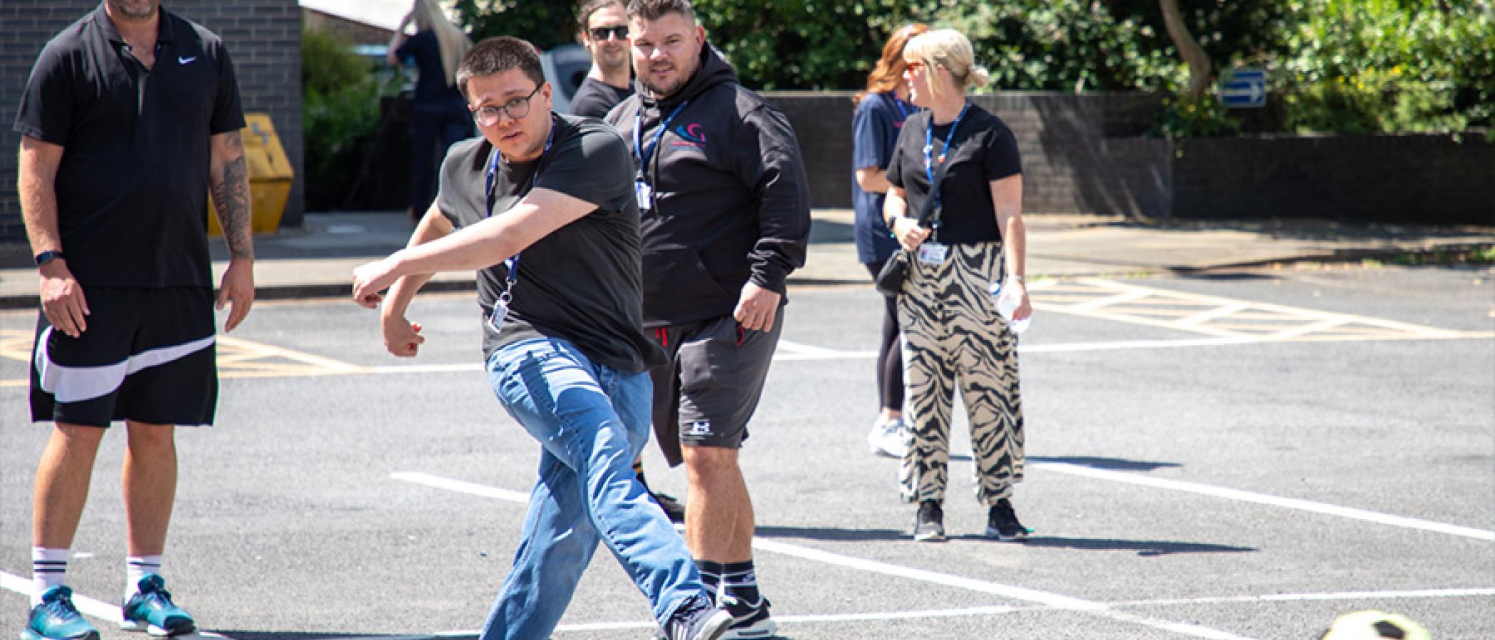 Staff play football darts
