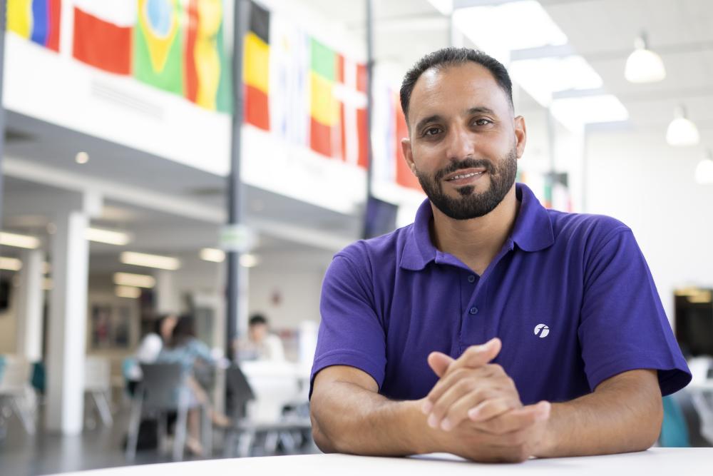 Photo of Walid in Tycoch Atrium, taken by Learning and Work Institute