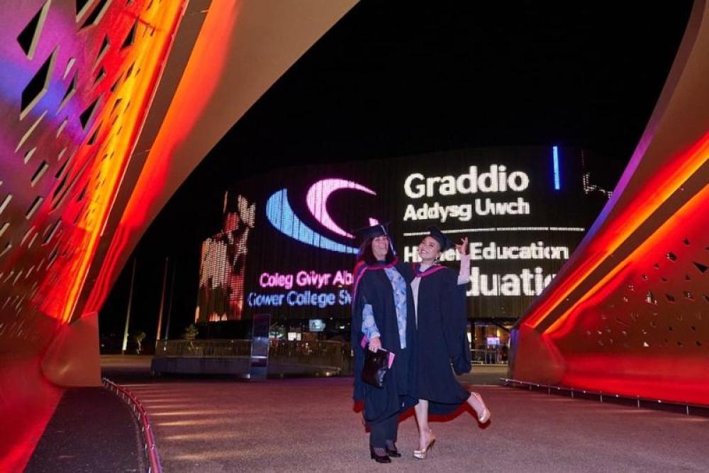 Students standing outside Swansea Arena 