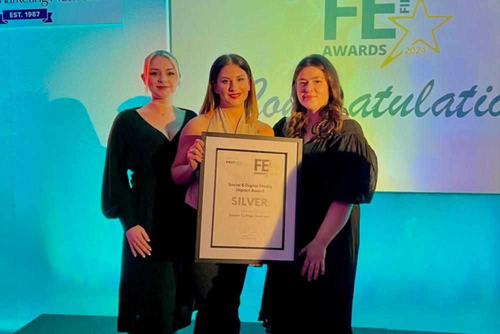 A small group of people smiling and holding a certifcate