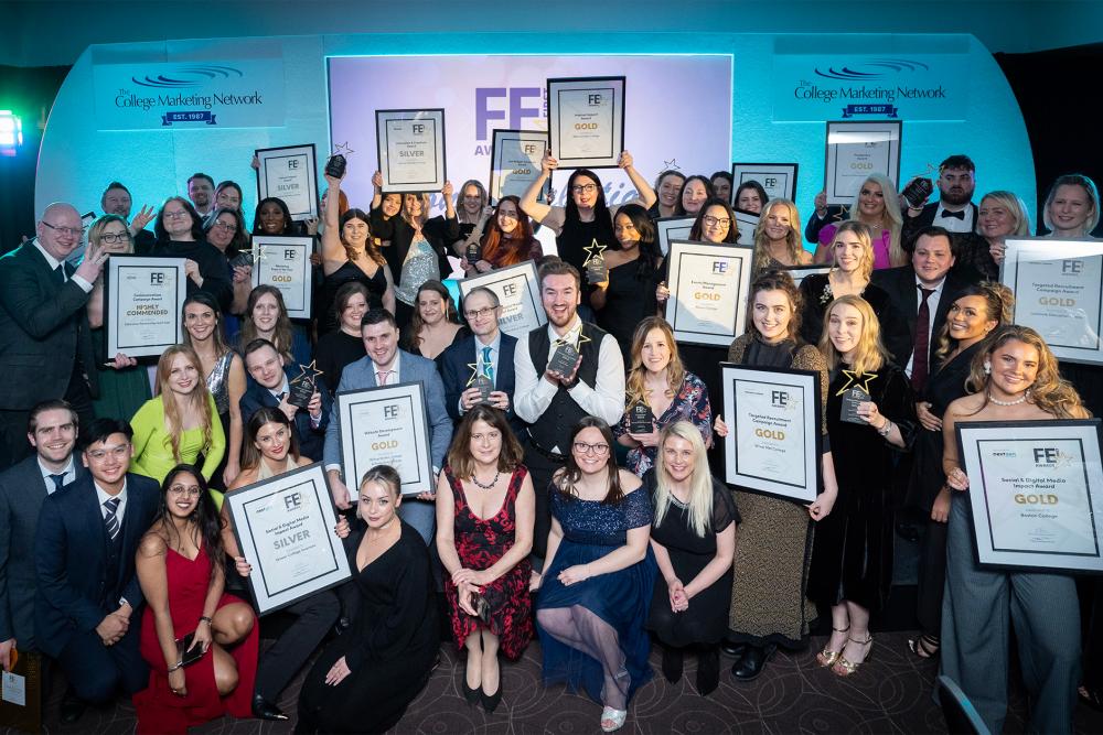 A big group of people smiling and holding certifcates