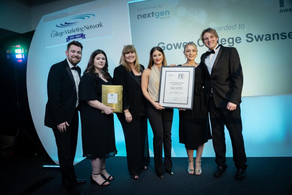 A small group of people smiling and holding a certifcate