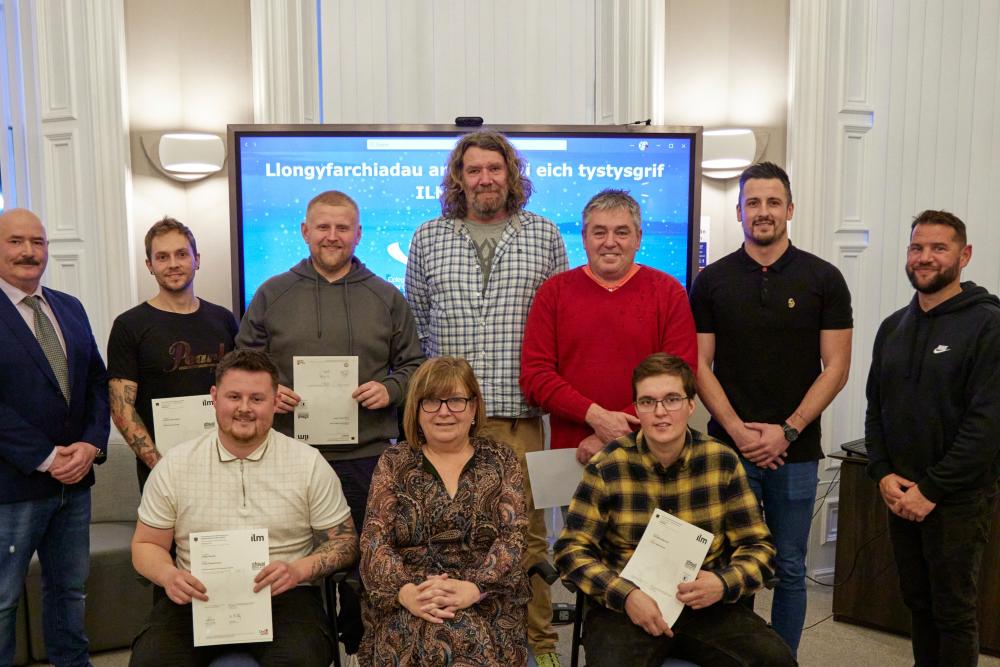 A group picture featuring the successful learners and their tutor, Susan Washer.