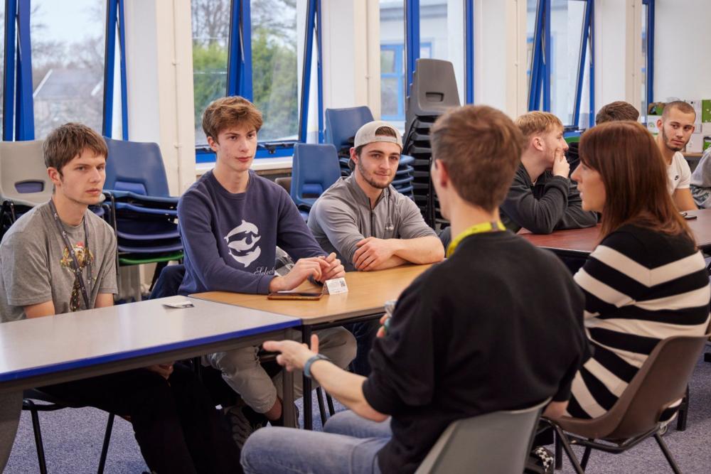 Students listening to a speaker