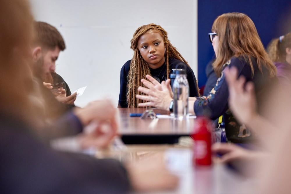 Student listening to peer