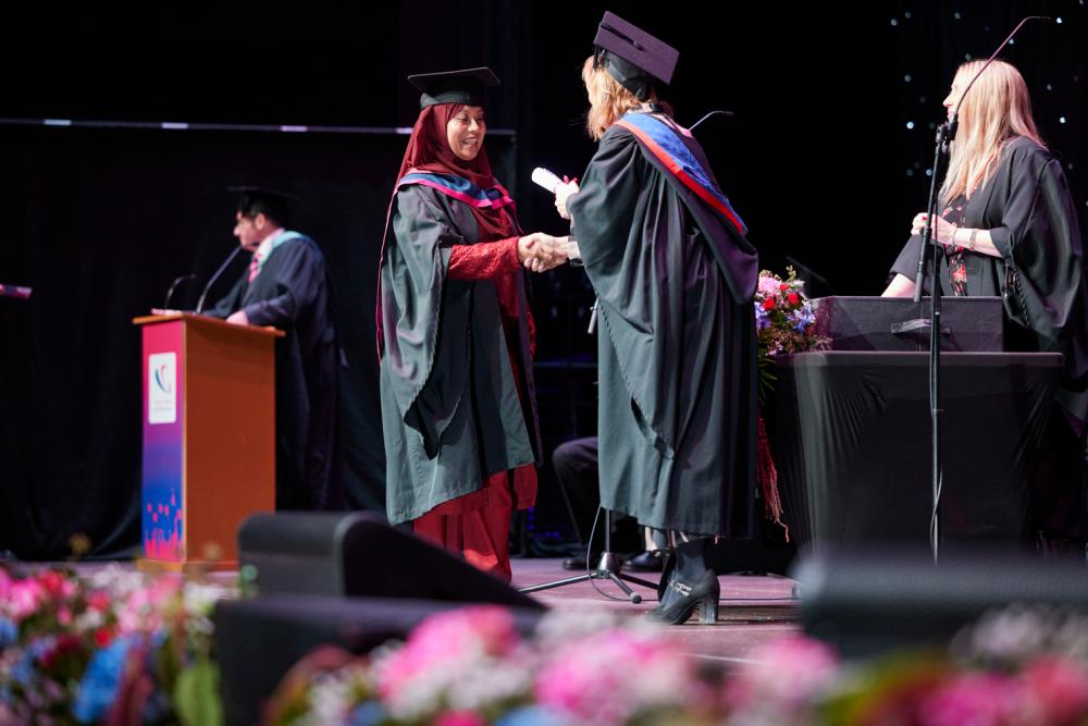 Graduate receiving scroll