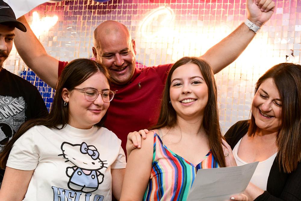 Student on A Level results day celebrating with family