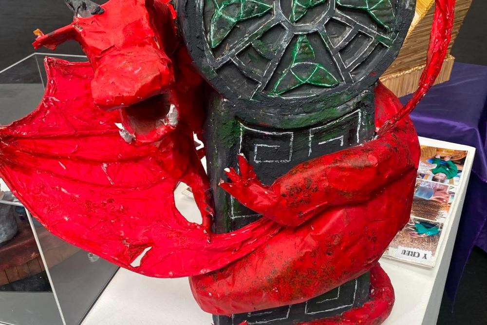 Sculpture of Dragon with Celtic cross