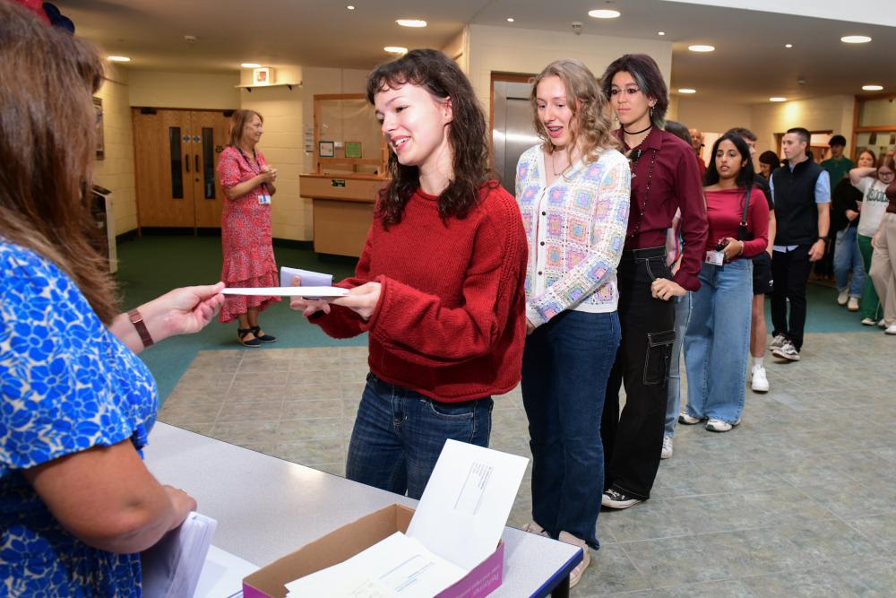 a student being handed her results 
