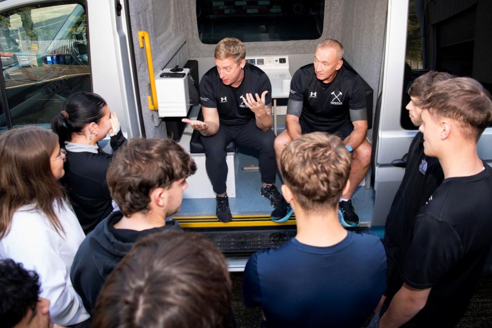 Firefighters talking to students