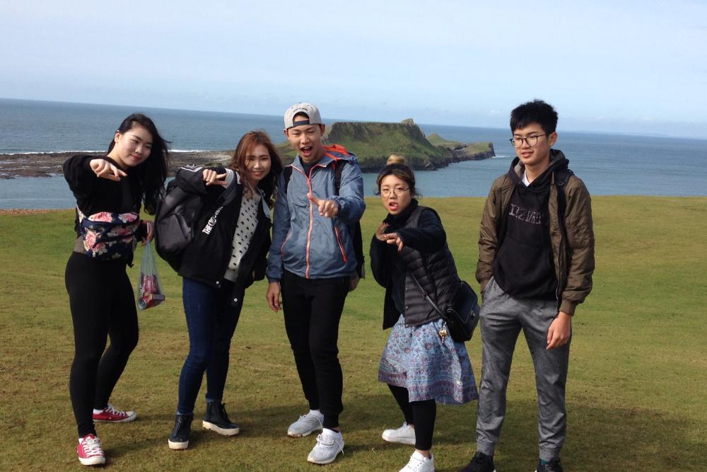 International students enjoy a day out at Rhossili Bay