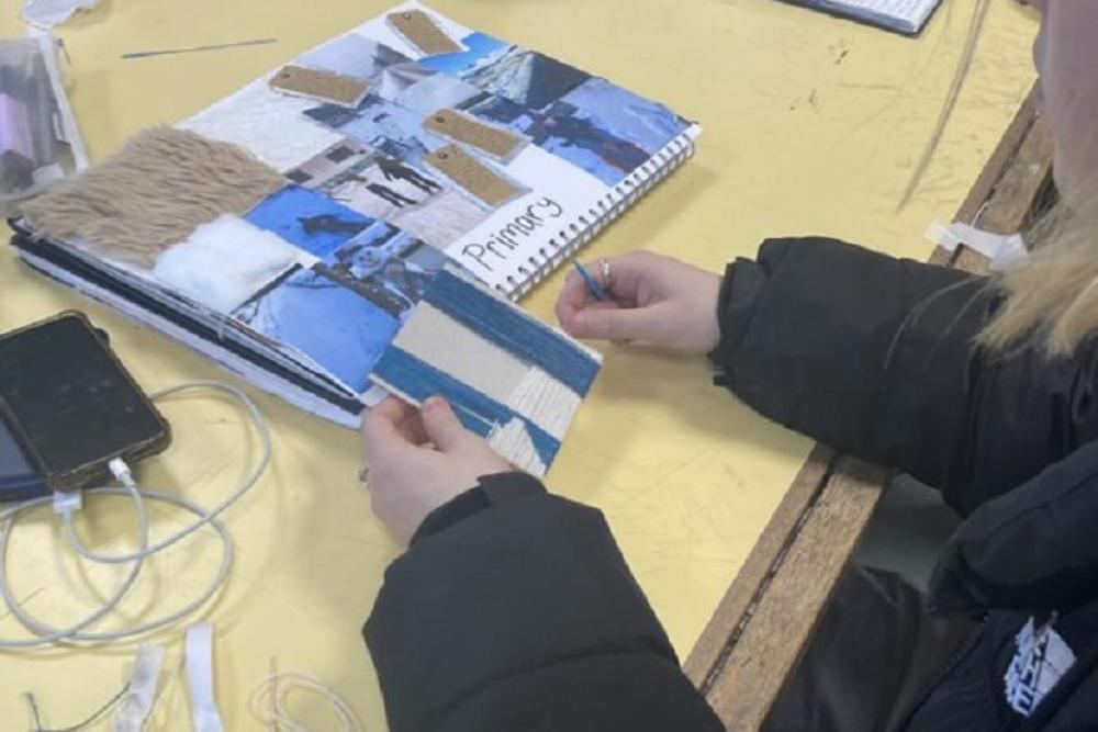 Student cutting in textiles