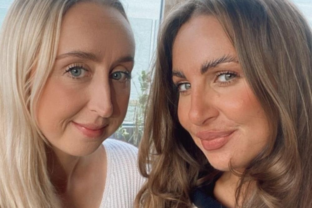 Two women smiling at camera / Dwy fenyw yn gwenu ar y camera