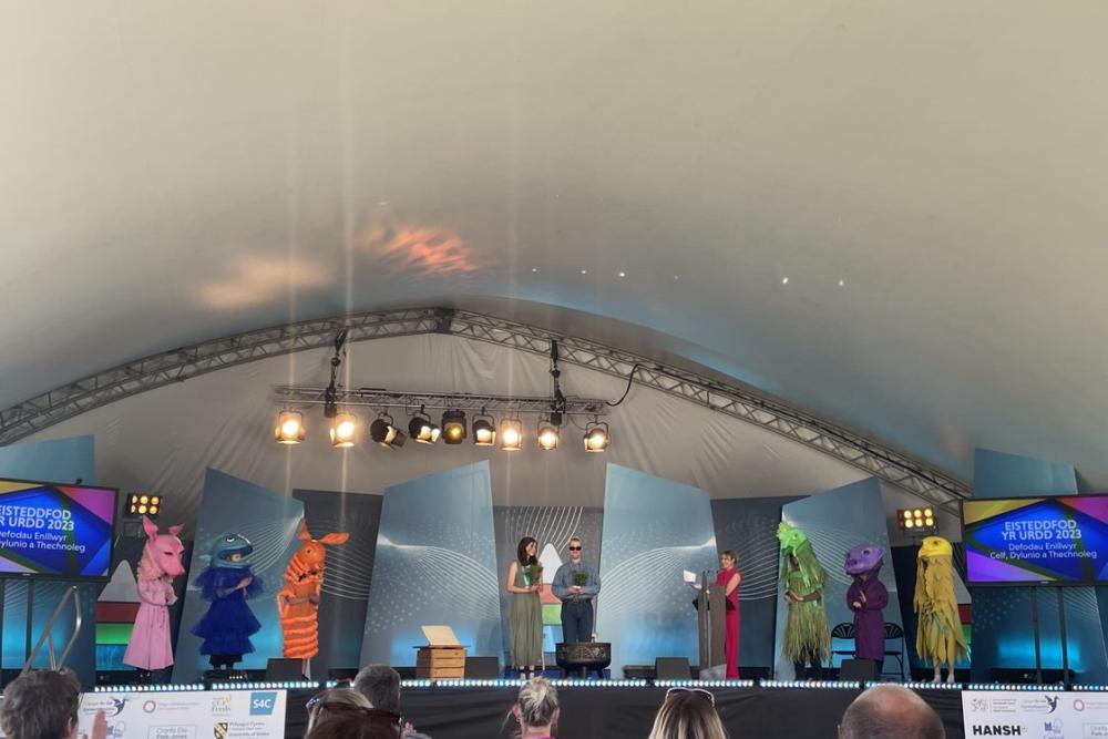Costumes on display on stage at URDD Eisteddfod