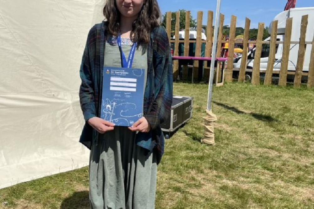 Costumes on display on stage at URDD Eisteddfod